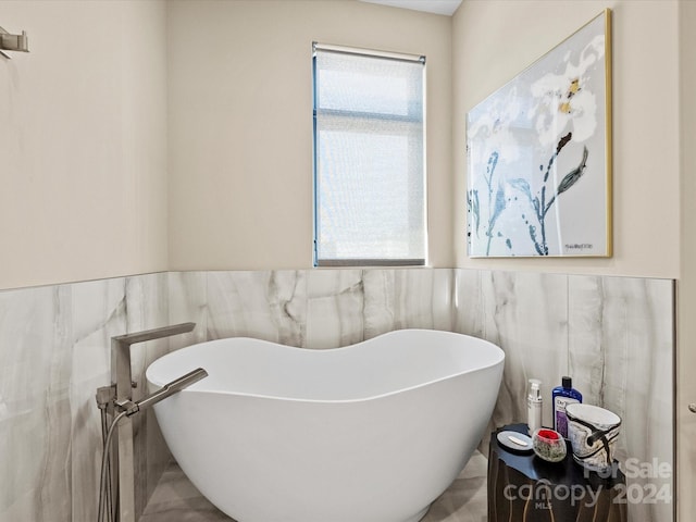 bathroom featuring tile walls