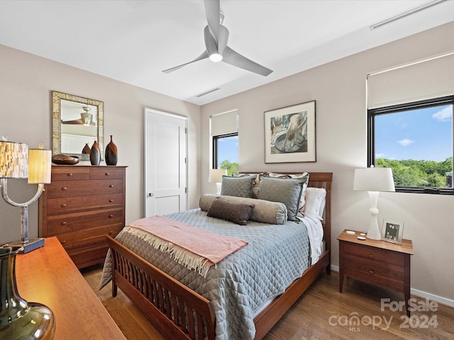 bedroom featuring ceiling fan and dark hardwood / wood-style flooring