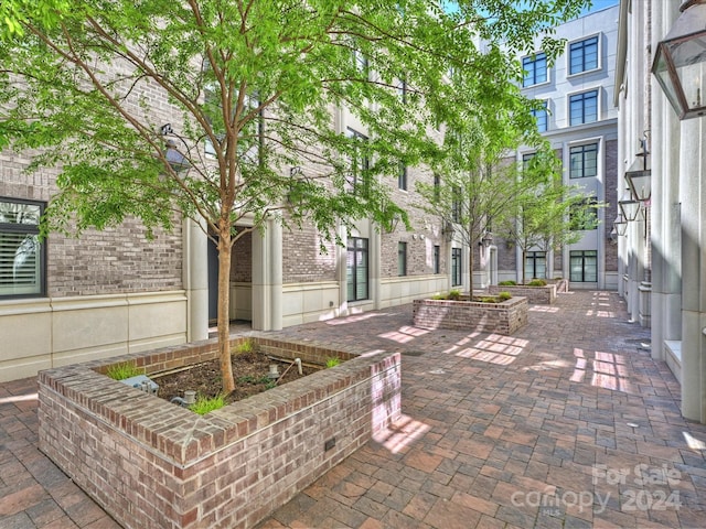 view of home's community with a patio area