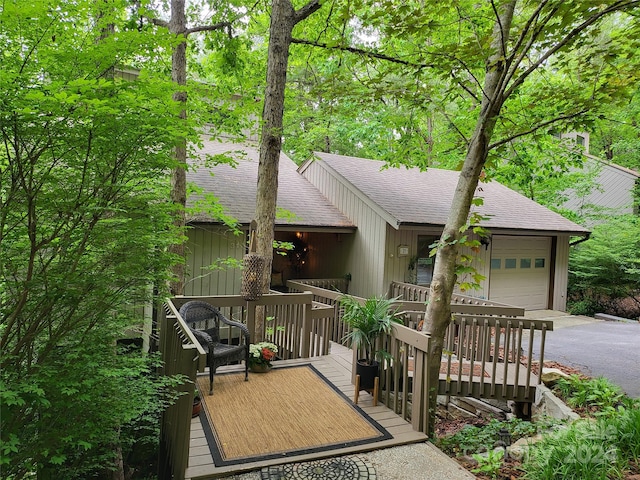 view of front facade with a deck and a garage