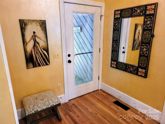 doorway featuring hardwood / wood-style floors