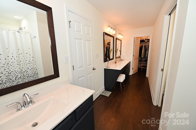 bathroom featuring hardwood / wood-style flooring and vanity