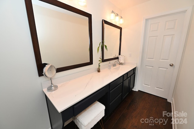 bathroom with vanity and hardwood / wood-style floors