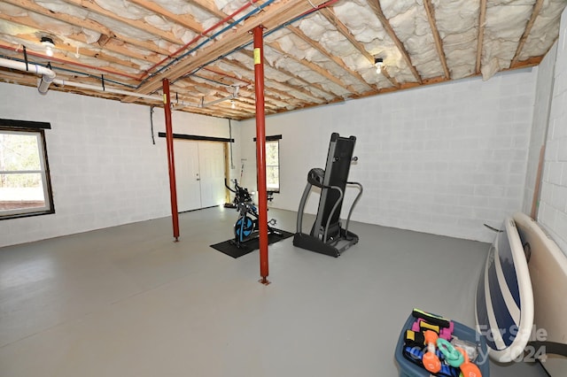 exercise room featuring concrete floors