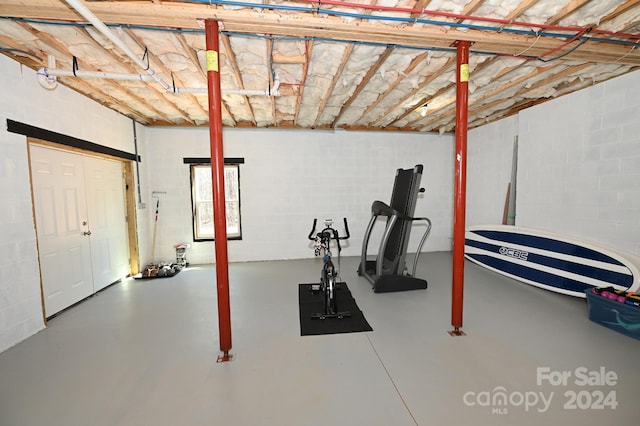 exercise area featuring concrete flooring