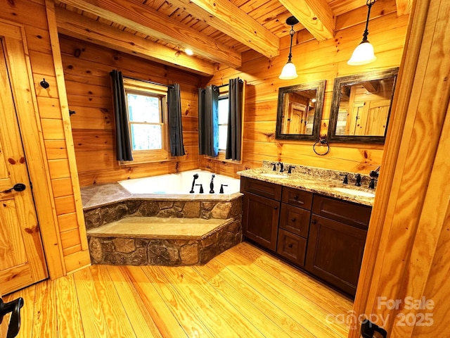 bathroom with hardwood / wood-style floors, wooden ceiling, beamed ceiling, and wood walls