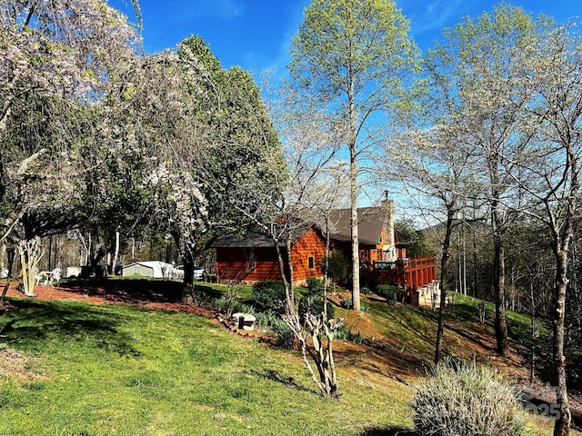 view of yard with a wooden deck