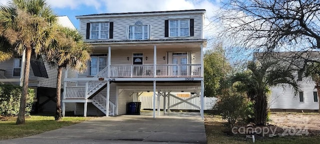 view of front of property with a carport and a porch