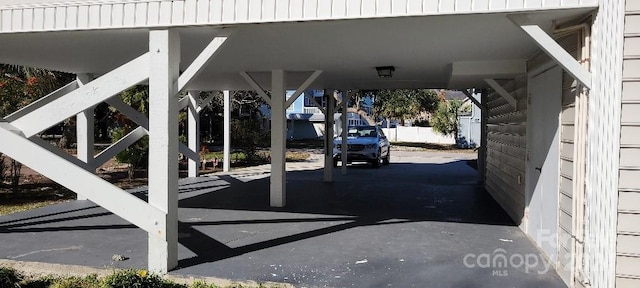 exterior space with a carport