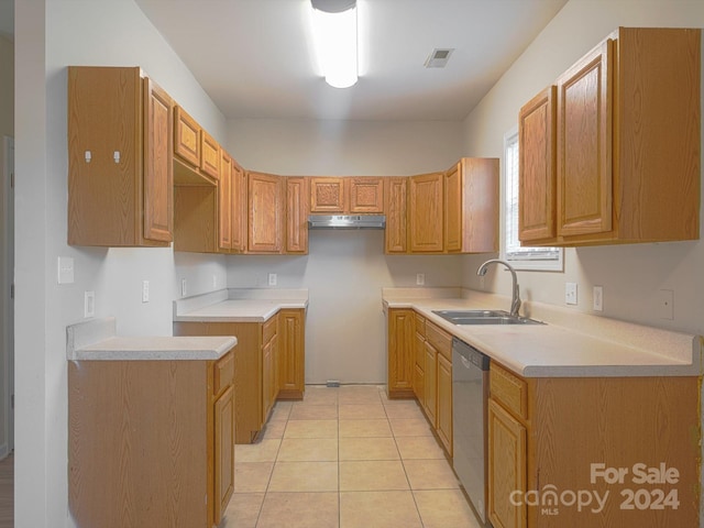 kitchen with stainless steel dishwasher, sink, and light tile patterned floors