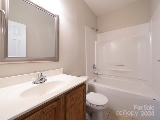 full bathroom with shower / tub combination, vanity, tile patterned flooring, and toilet