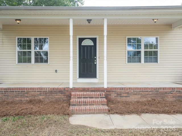 property entrance with a porch