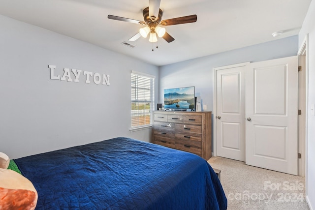 carpeted bedroom with ceiling fan