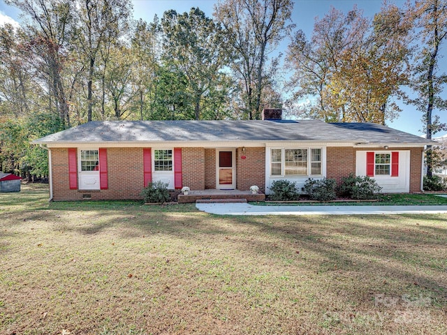 ranch-style house with a front lawn