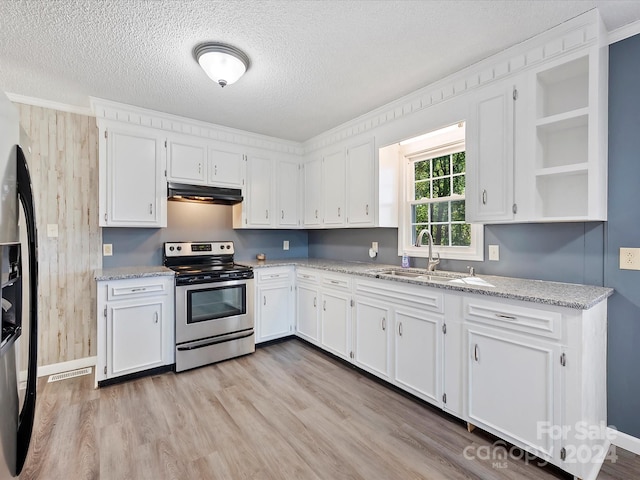 kitchen featuring stainless steel appliances, sink, light stone countertops, light wood-type flooring, and white cabinets