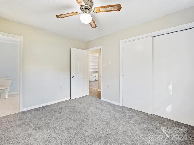 111 Bobby Lee Ln Unit 18, Mooresville, NC 28115 - unfurnished bedroom with carpet, a closet, baseboards, a ceiling fan, and connected bathroom