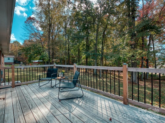 wooden deck with a yard