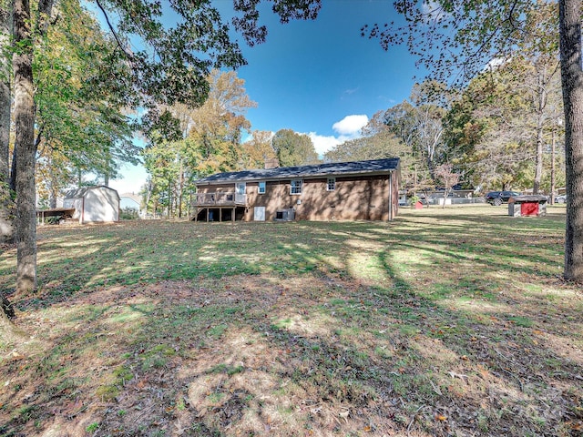 111 Bobby Lee Ln Unit 18, Mooresville, NC 28115 - view of green lawn featuring a deck and central AC unit