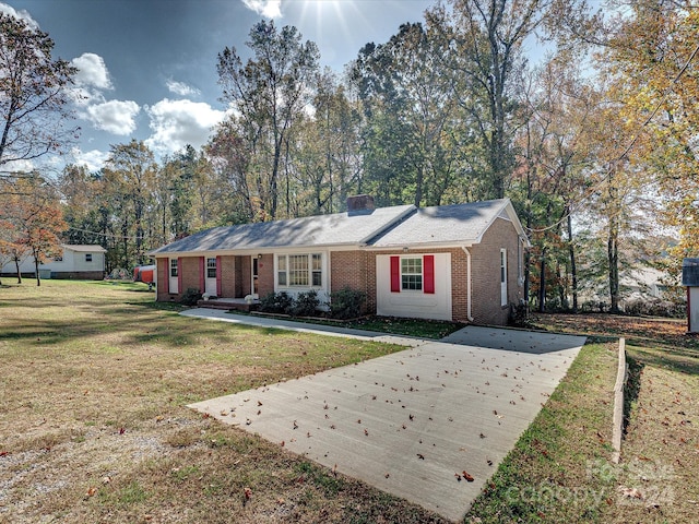 111 Bobby Lee Ln Unit 18, Mooresville, NC 28115 - single story home with brick siding, a front yard, concrete driveway, and a chimney