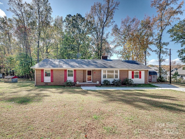111 Bobby Lee Ln Unit 18, Mooresville, NC 28115 - ranch-style house with brick siding, a front lawn, a chimney, and a shed
