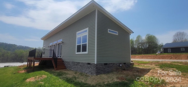 view of home's exterior featuring a deck