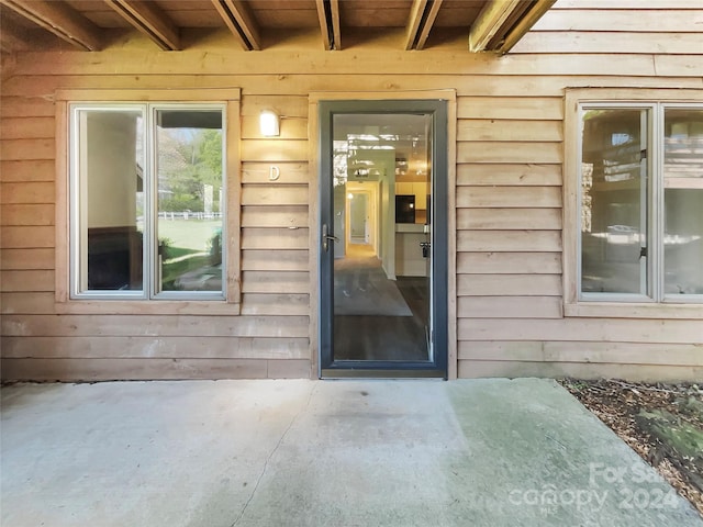 entrance to property with a patio area