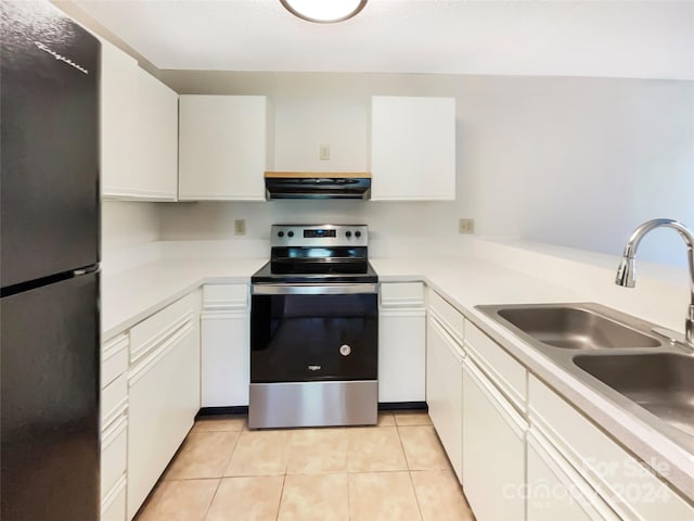 kitchen featuring stainless steel range with electric cooktop, white cabinetry, light tile flooring, refrigerator, and exhaust hood