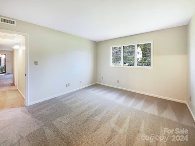 view of carpeted spare room