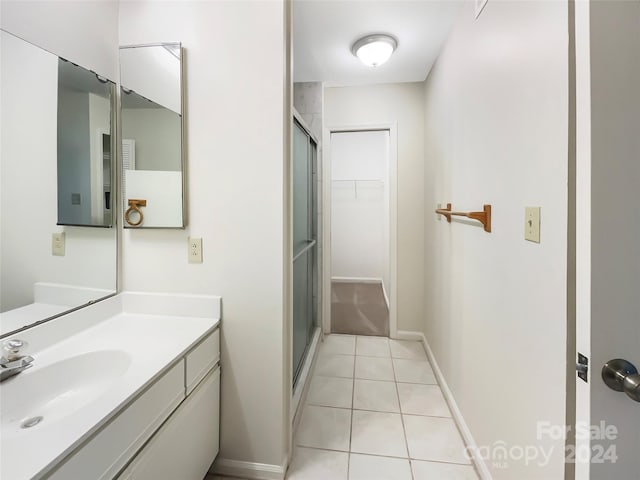 bathroom featuring vanity and tile flooring