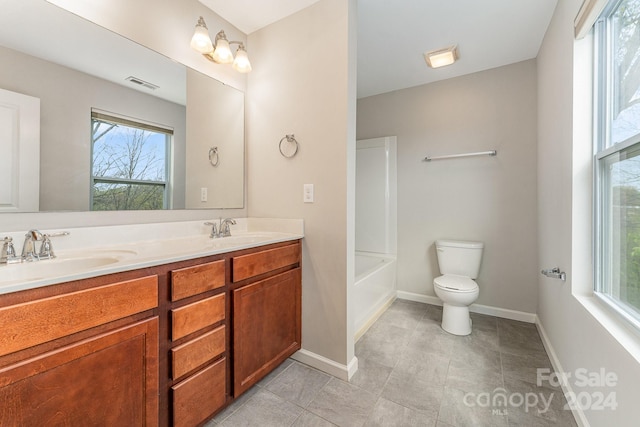 bathroom featuring toilet and vanity