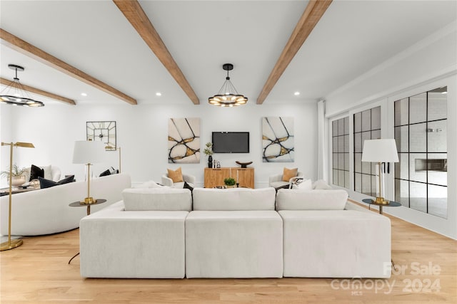 living room with beam ceiling, light hardwood / wood-style floors, and a chandelier