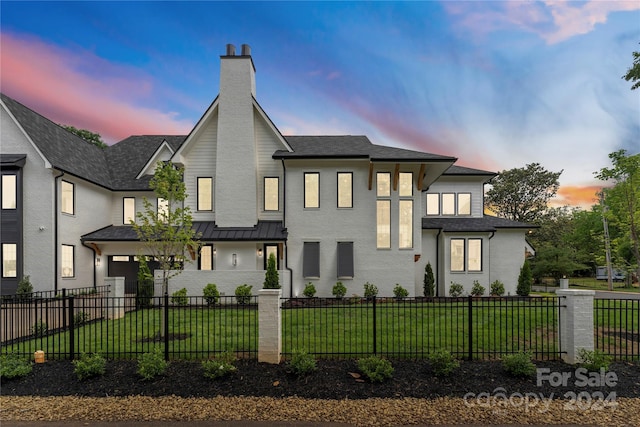 view of front of property with a lawn