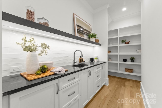 4142 Pineview Rd, Charlotte, NC 28211 - bar with a sink, ornamental molding, light wood finished floors, tasteful backsplash, and recessed lighting
