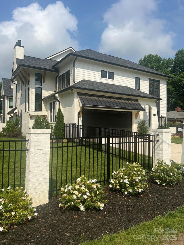 4142 Pineview Rd, Charlotte, NC 28211 - view of front facade with a chimney, a garage, and brick siding