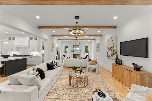 4142 Pineview Rd, Charlotte, NC 28211 - living room with light wood-type flooring, beamed ceiling, recessed lighting, baseboards, and crown molding