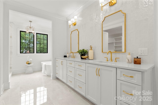 4142 Pineview Rd, Charlotte, NC 28211 - full bath featuring double vanity, a soaking tub, crown molding, marble finish flooring, and a chandelier
