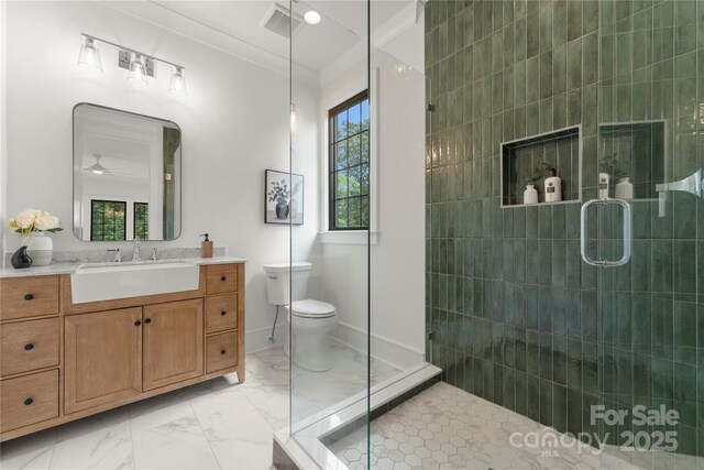 4142 Pineview Rd, Charlotte, NC 28211 - full bath with marble finish flooring, a shower stall, vanity, a ceiling fan, and toilet