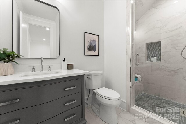 4142 Pineview Rd, Charlotte, NC 28211 - full bathroom with marble look tiles, a marble finish shower, toilet, and vanity