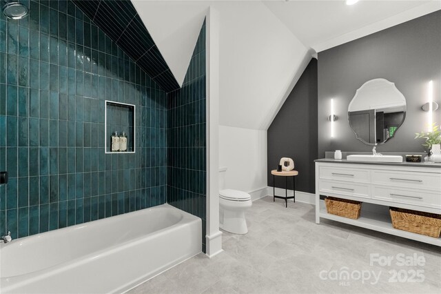 4142 Pineview Rd, Charlotte, NC 28211 - full bathroom with vanity, toilet, bathtub / shower combination, vaulted ceiling, and baseboards