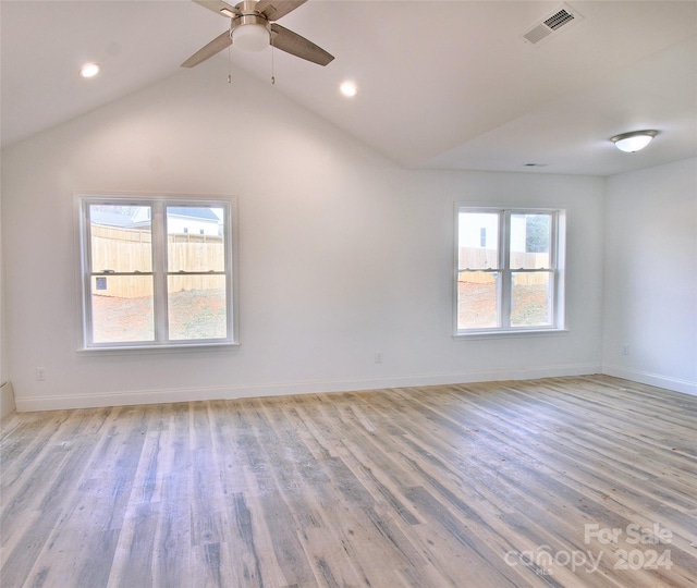 unfurnished room featuring lofted ceiling, ceiling fan, and light hardwood / wood-style floors