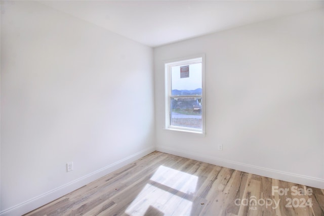 unfurnished room featuring light wood-type flooring