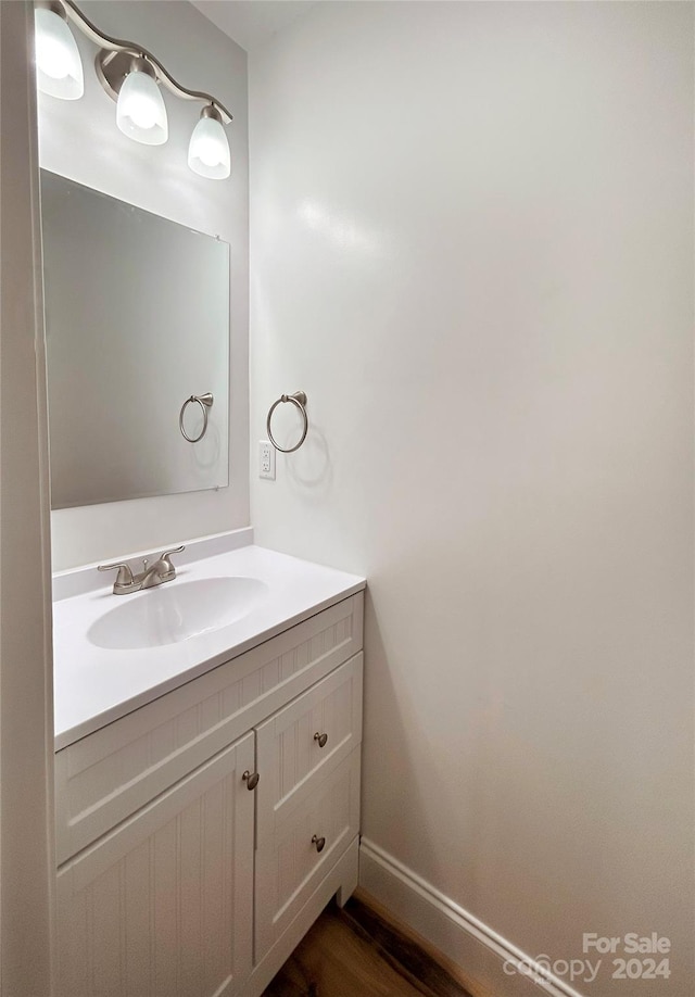 bathroom featuring vanity and wood-type flooring