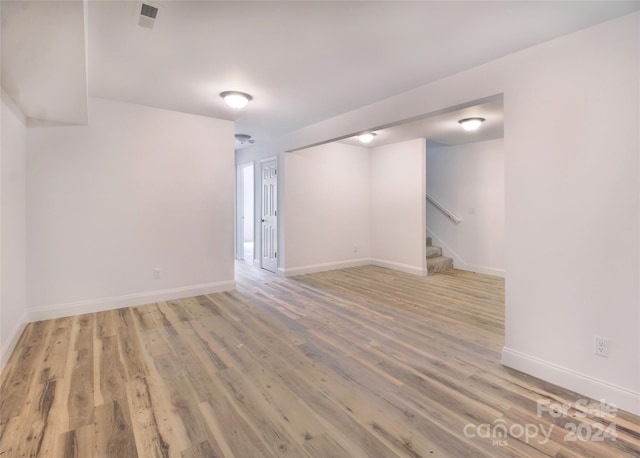 basement featuring wood-type flooring