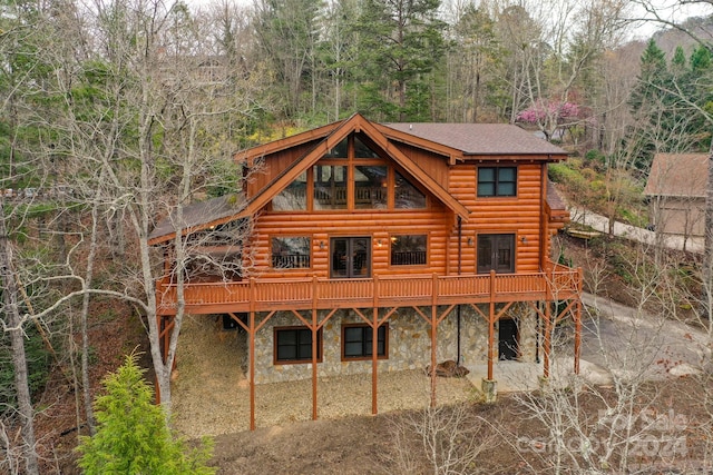 back of house with a wooden deck