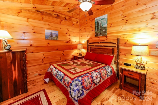 bedroom with wooden ceiling, light hardwood / wood-style flooring, and ceiling fan