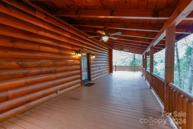 wooden terrace featuring ceiling fan