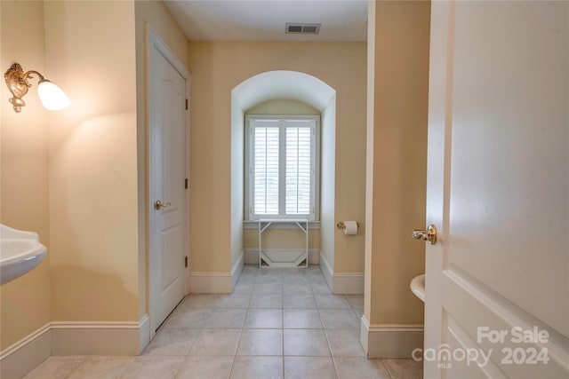 bathroom with tile patterned floors