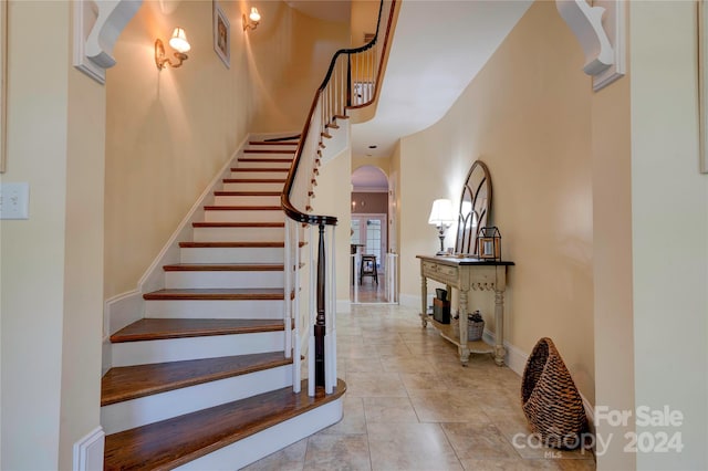 stairway featuring tile patterned floors