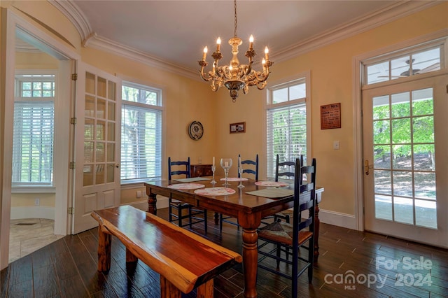 dining space with a notable chandelier, ornamental molding, and dark wood-type flooring