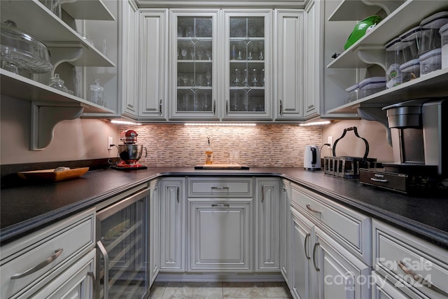 kitchen featuring backsplash and beverage cooler